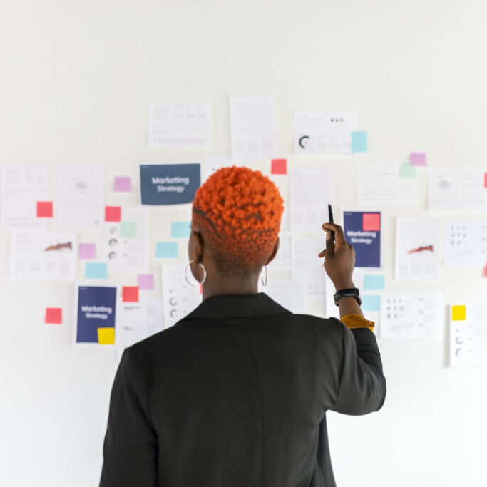 Cool black businesswoman planning a marketing strategy Cool black businesswoman planning a marketing strategy