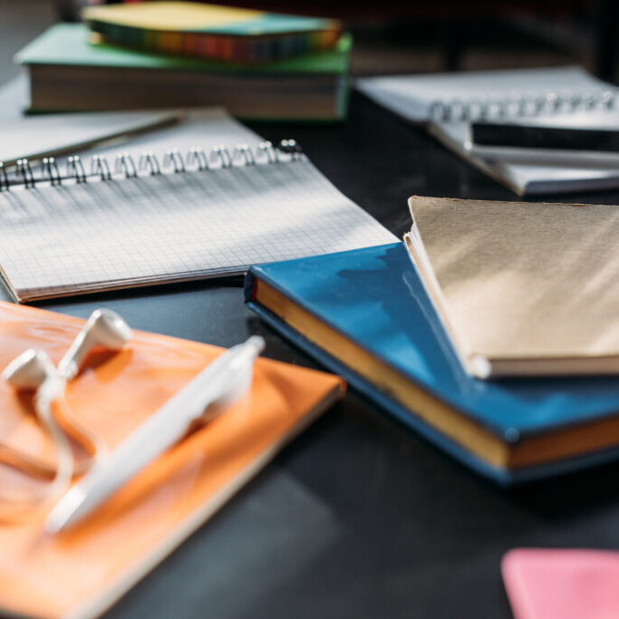 notebooks and books for studying on black table notebooks and books for studying on black table